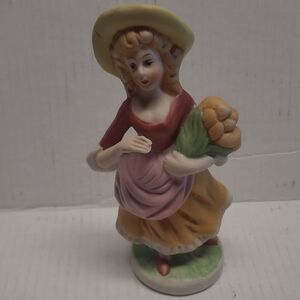 W02: Charming Ceramic Figurine with Basket